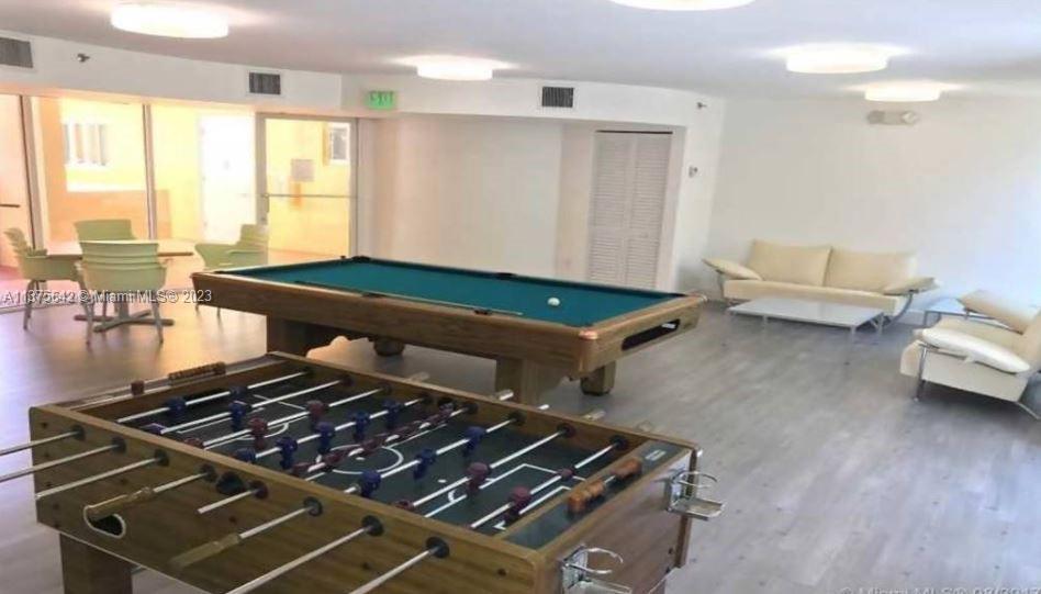 Normandy Beach Surfside, FL 33154 - Photo 7 of 32 a room with furniture and a large window