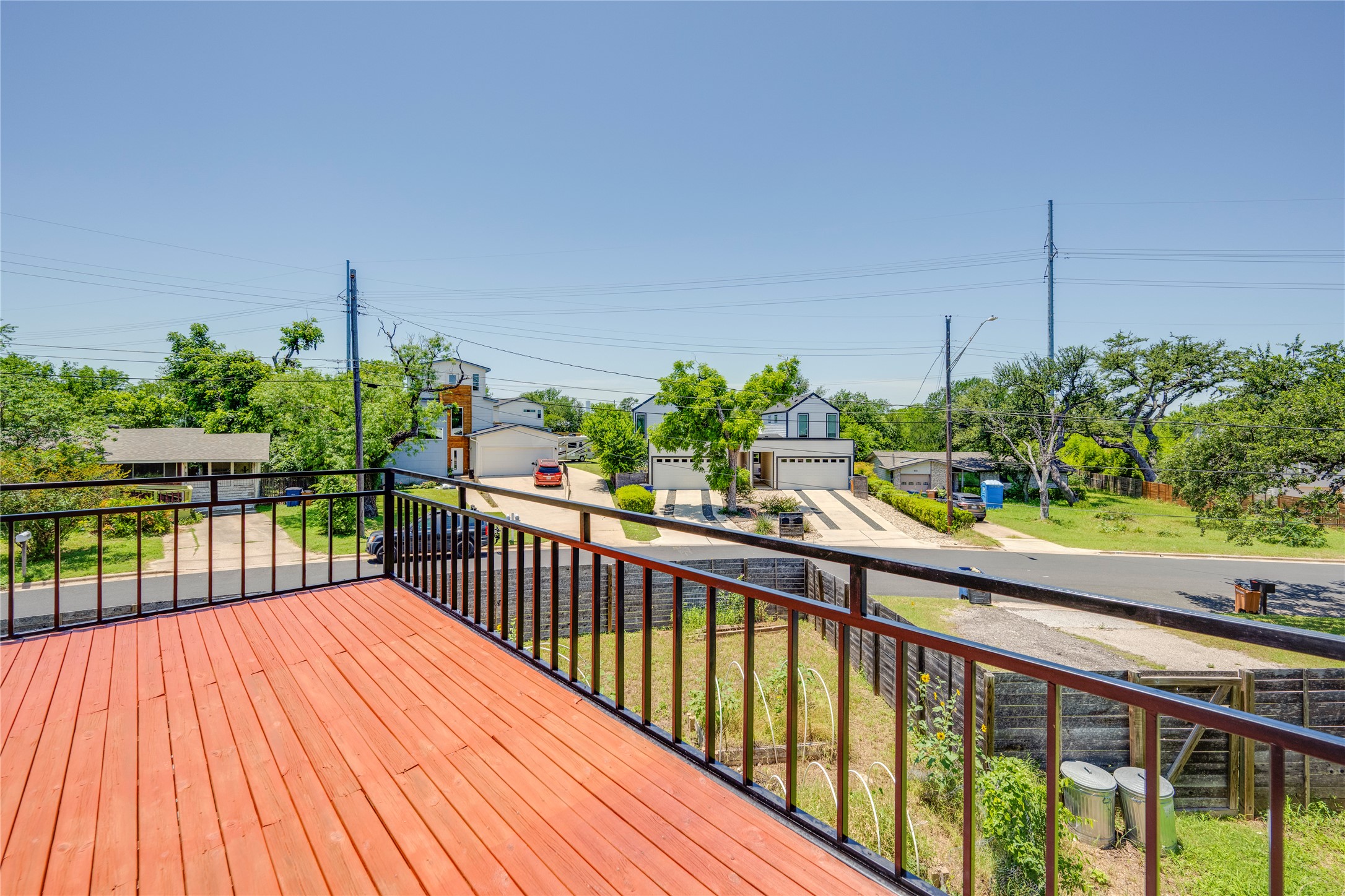 1707 Overhill Drive Austin, TX 78721 - Photo 26 of 36 Perched high above, an inviting wood deck offers sweeping neighborhood views and sunny relaxation.