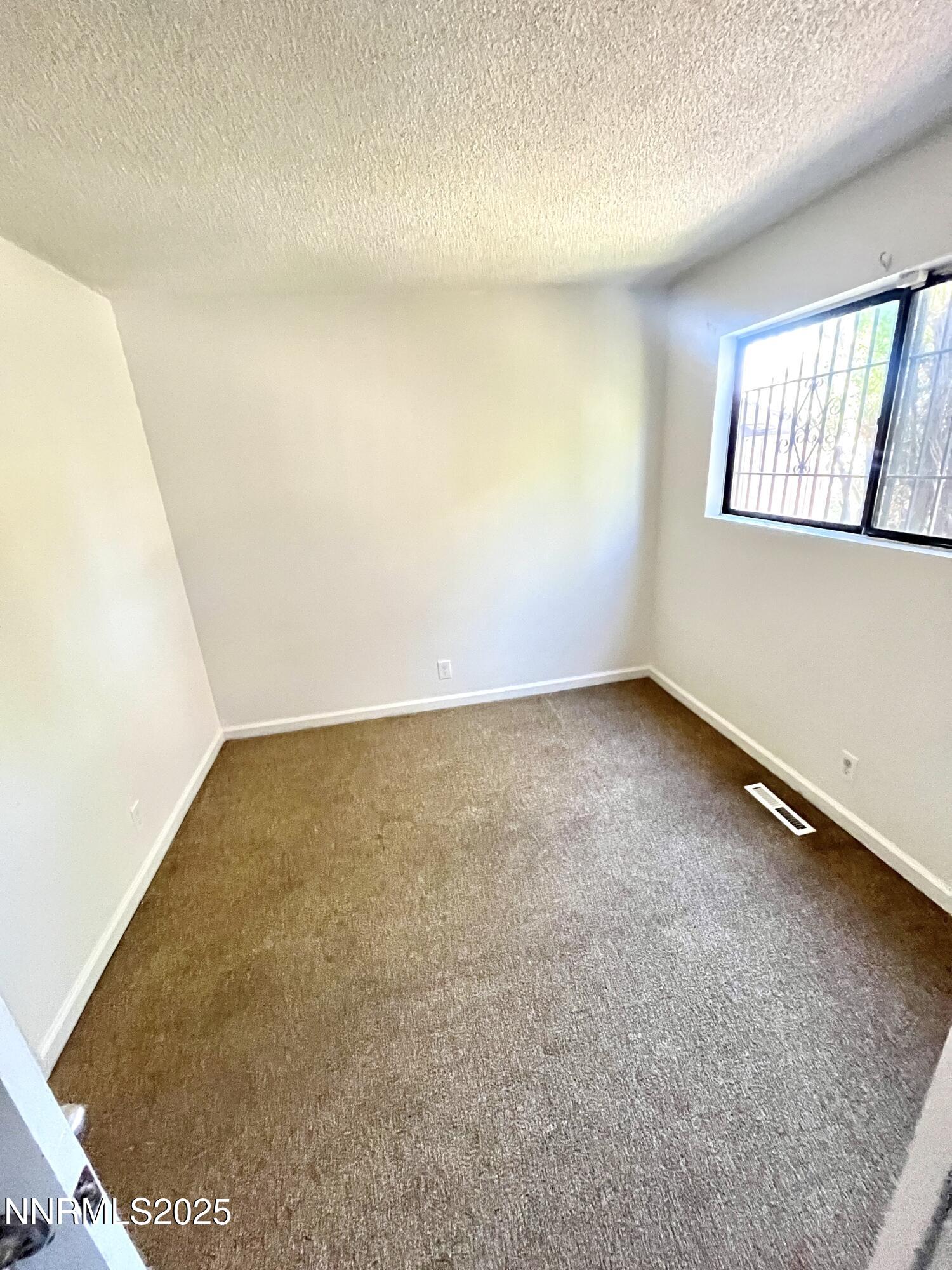1695 Trabert Way Sparks, NV 89431 - Photo 11 of 17 an empty room with windows