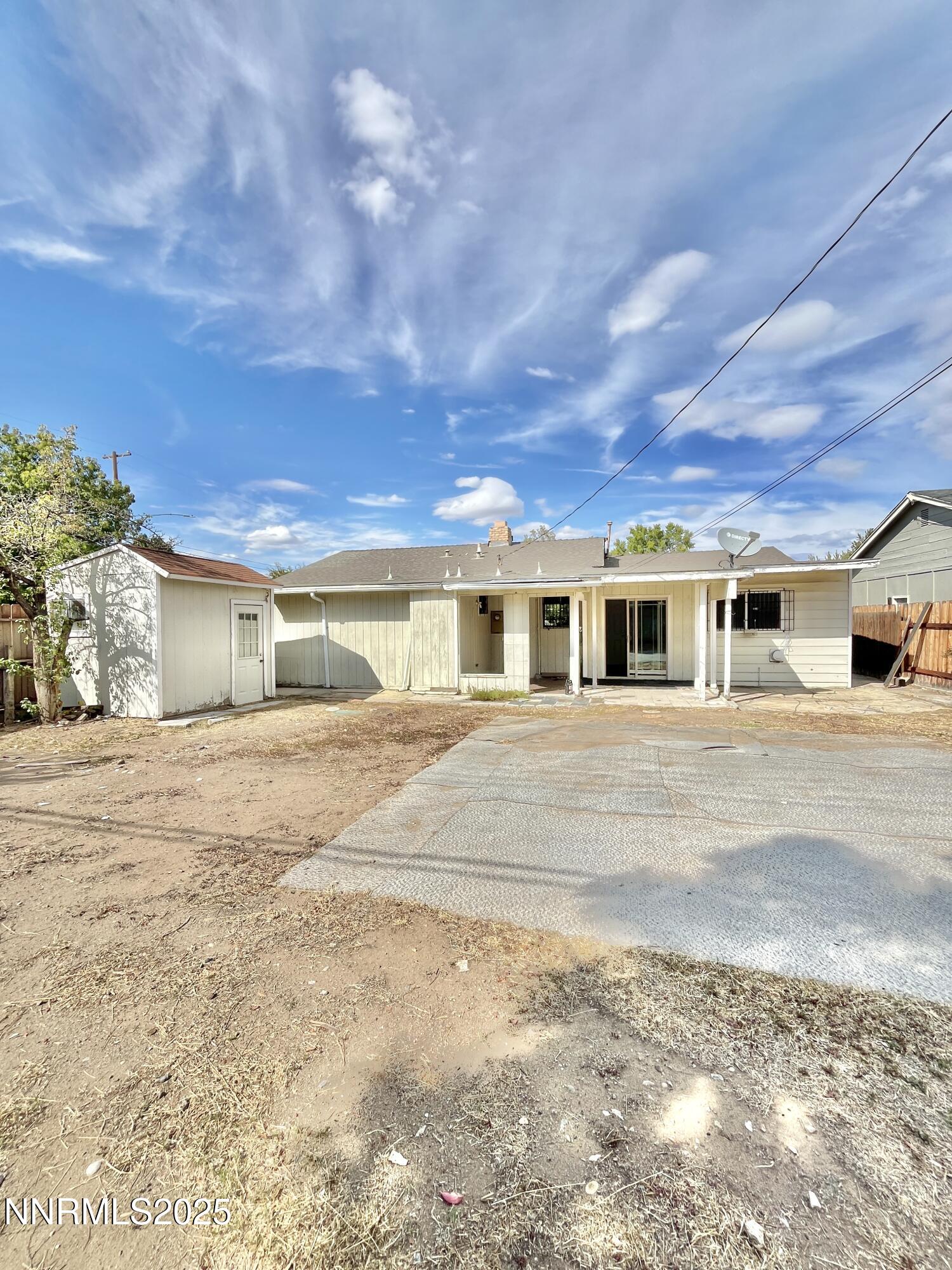 1695 Trabert Way Sparks, NV 89431 - Photo 16 of 17 a front view of a house with a yard and garage