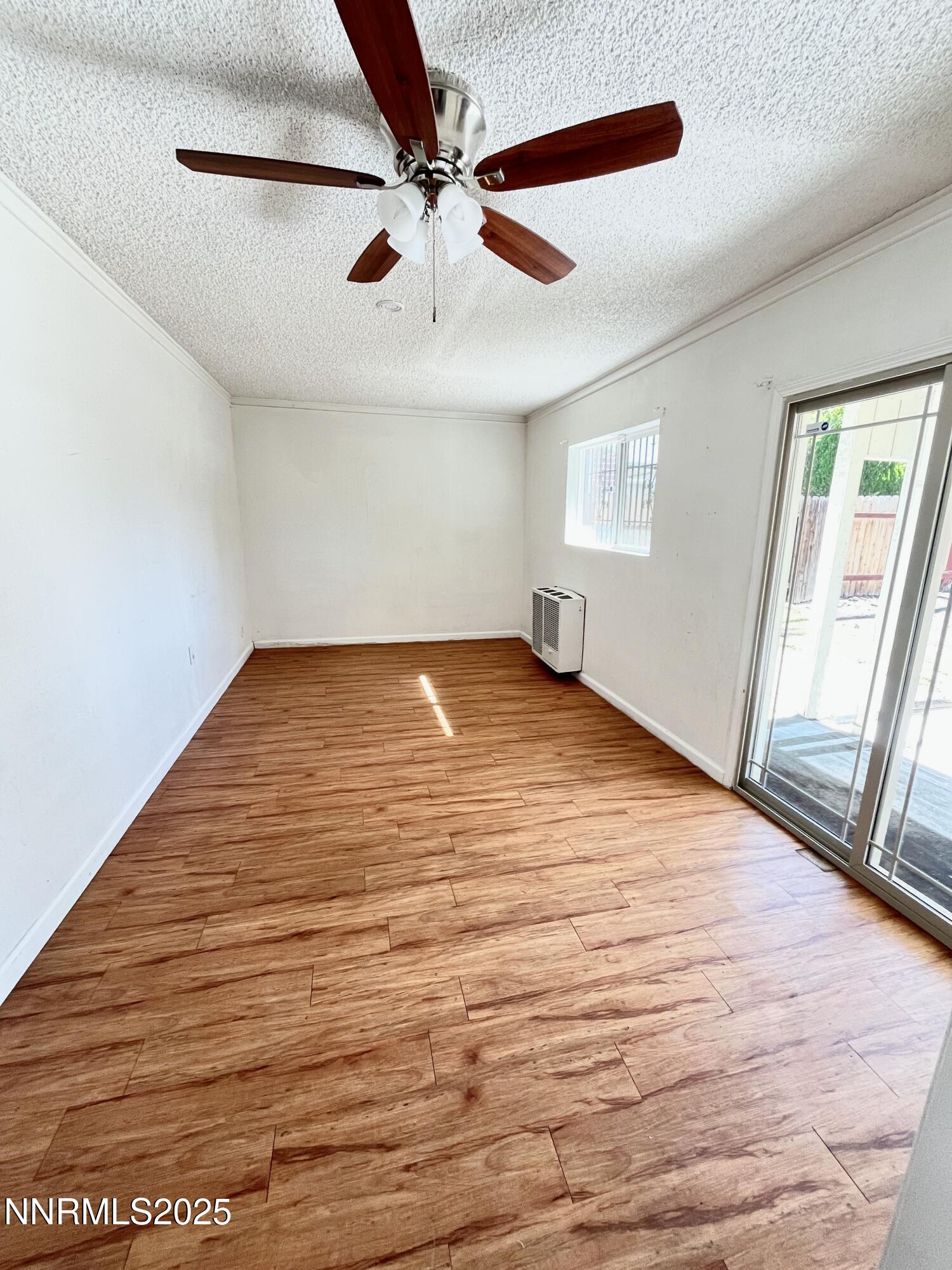 1695 Trabert Way Sparks, NV 89431 - Photo 4 of 17 an empty room with fan and windows