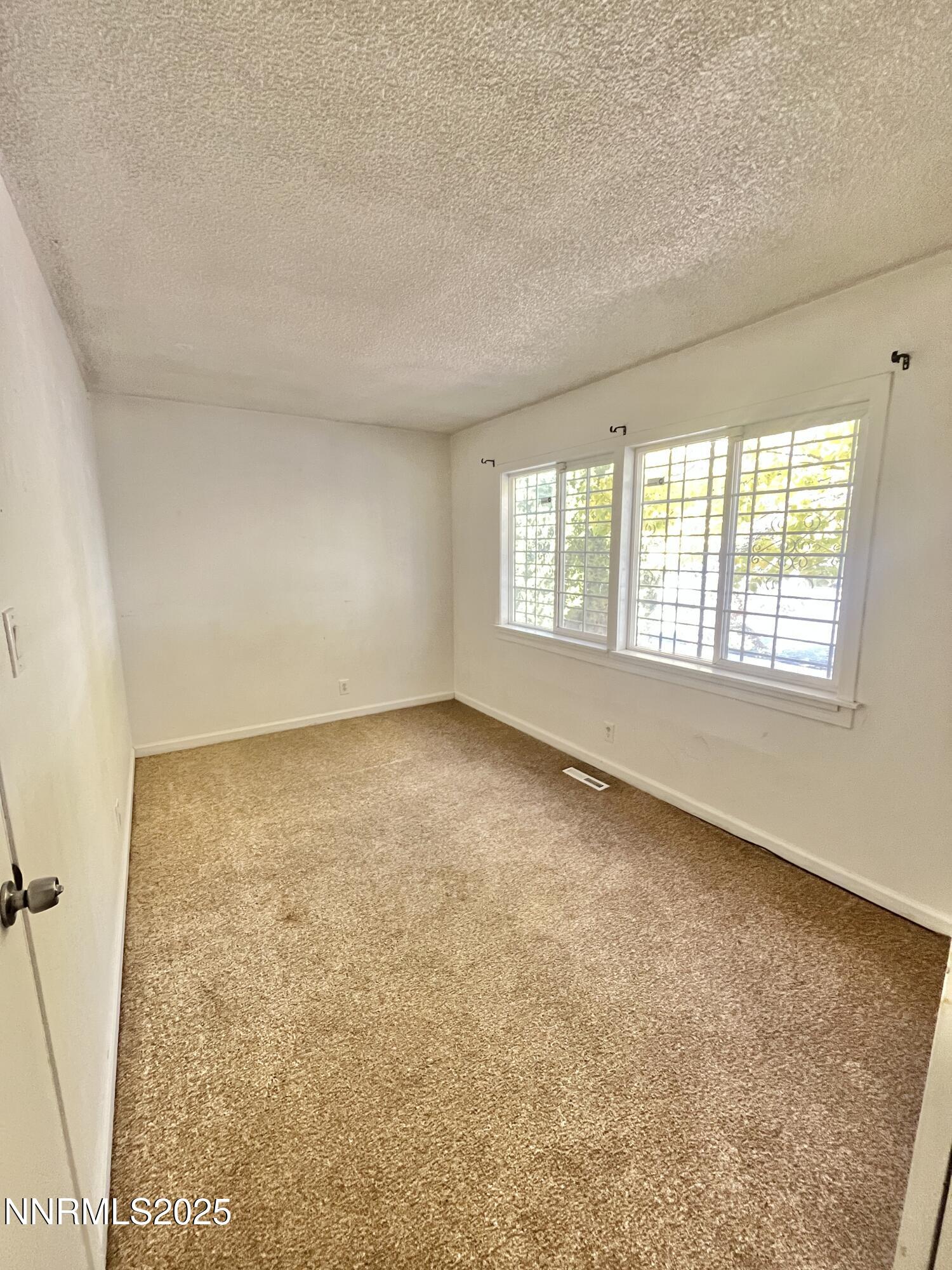 1695 Trabert Way Sparks, NV 89431 - Photo 7 of 17 an empty room with windows