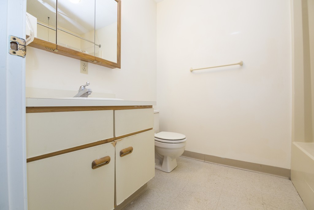 50 South Common Street, Unit 403 Lynn, MA 01902 - Photo 13 of 16 a bathroom with a toilet