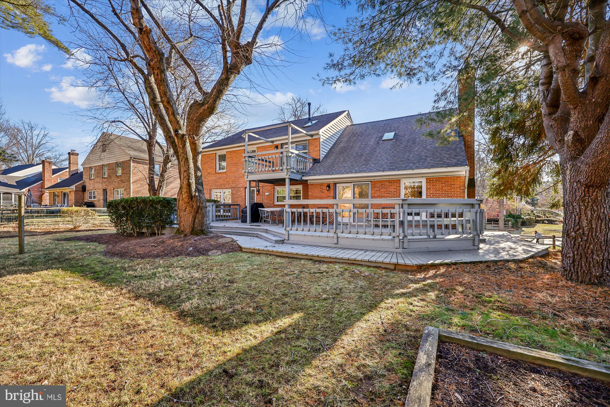 8809 Cold Spring Road Potomac, MD 20854 - Photo 2 of 2 a view of a house with a yard and large trees