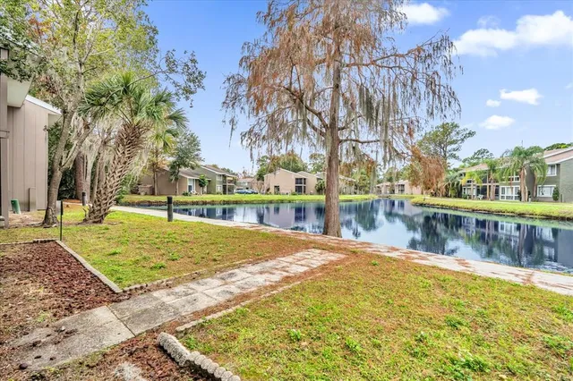 an aerial view of lake residential house with outdoor space