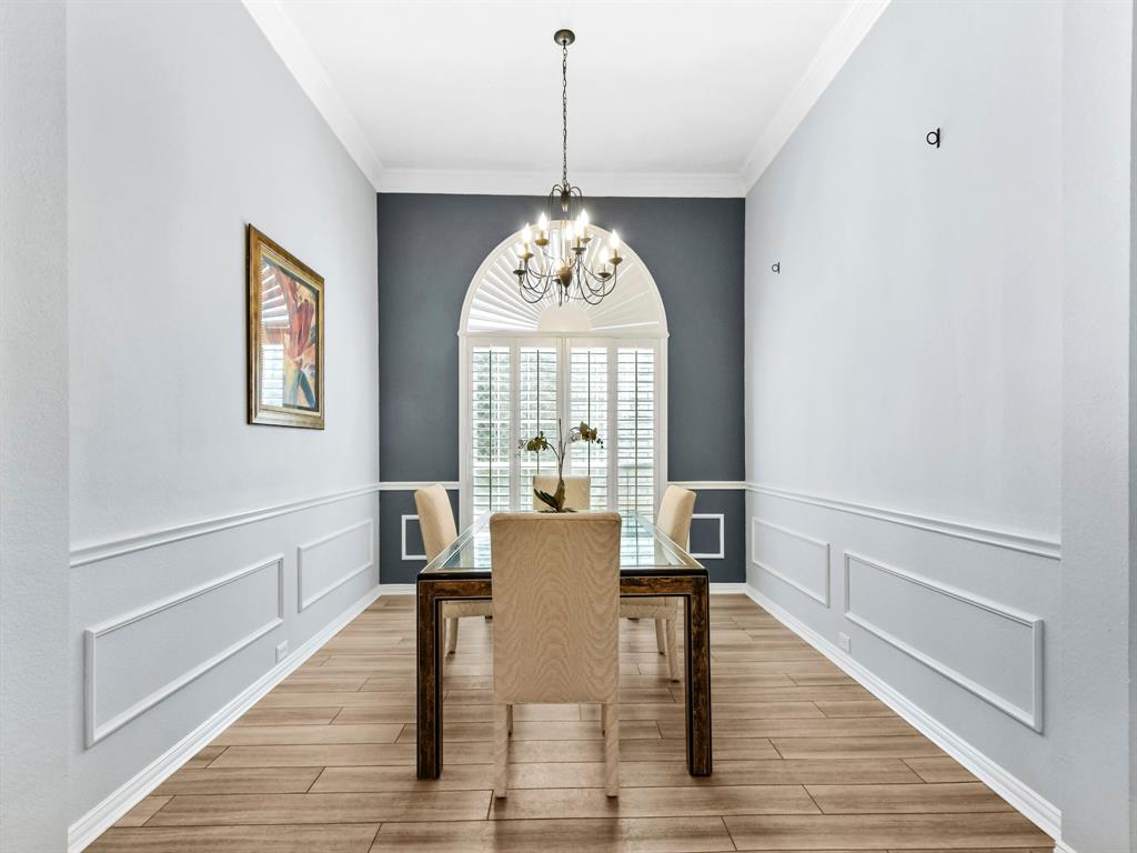 4025 Azure Lane Addison, TX 75001 - Photo 11 of 40 a view of a dining room with furniture window and wooden floor