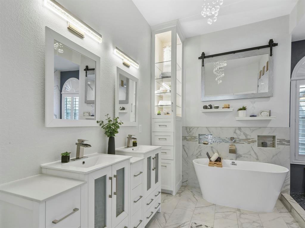 4025 Azure Lane Addison, TX 75001 - Photo 19 of 40 a bathroom with a double vanity sink mirror double and bathtub