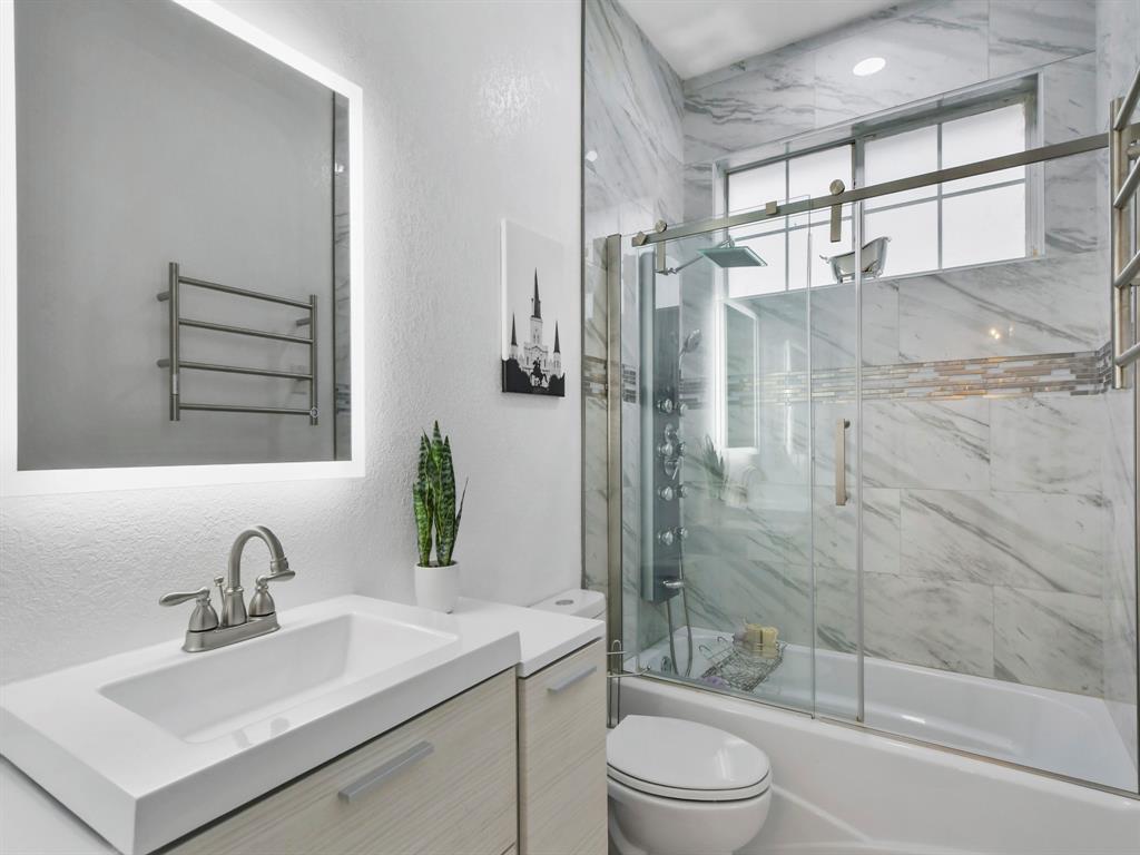 4025 Azure Lane Addison, TX 75001 - Photo 24 of 40 a bathroom with a sink toilet and shower
