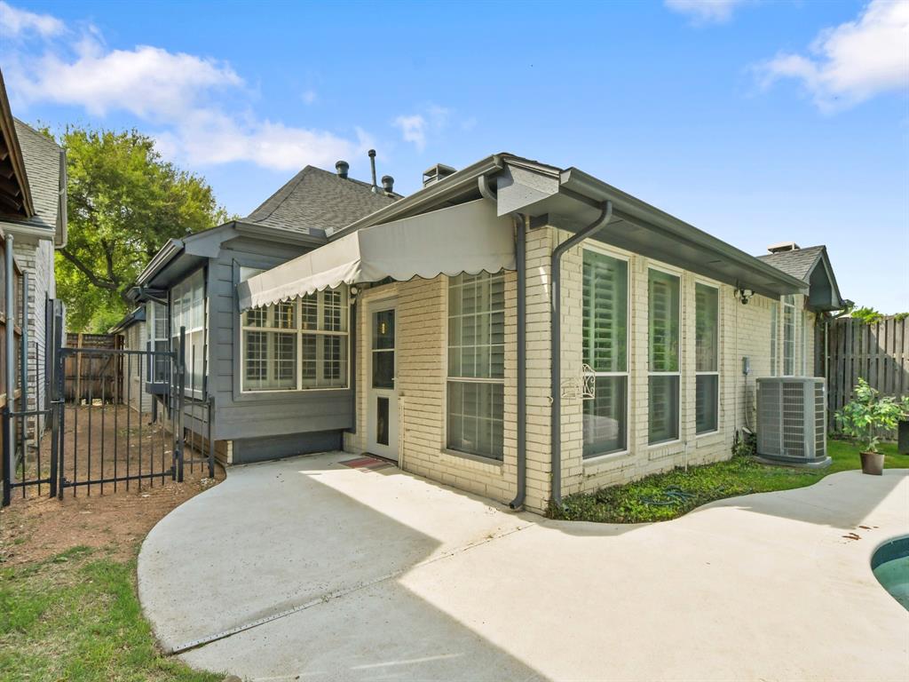 4025 Azure Lane Addison, TX 75001 - Photo 27 of 40 a front view of a house with a garden