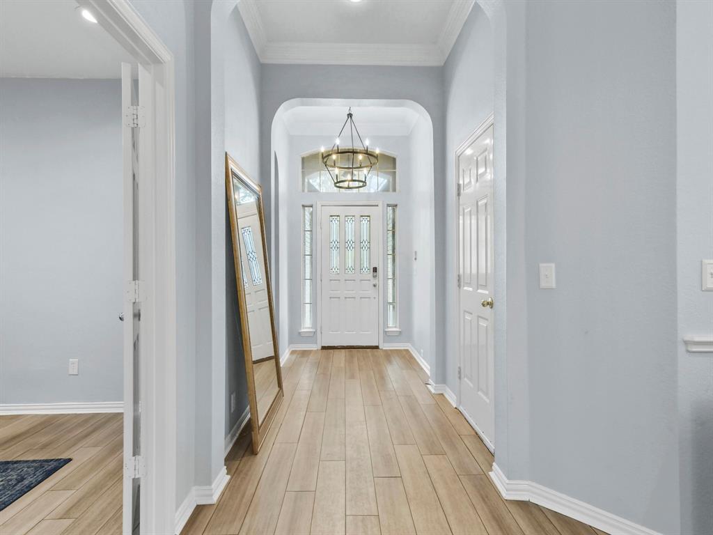 4025 Azure Lane Addison, TX 75001 - Photo 4 of 40 a view of a hallway with wooden floor
