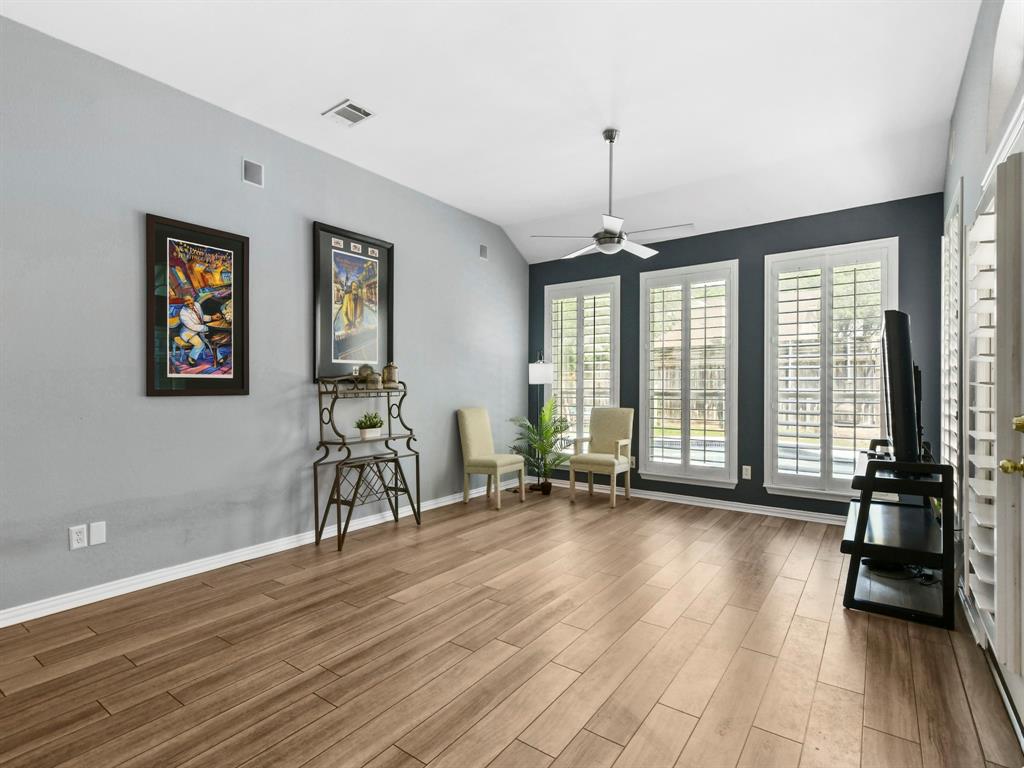 4025 Azure Lane Addison, TX 75001 - Photo 8 of 40 a view of a room with gym equipment and windows
