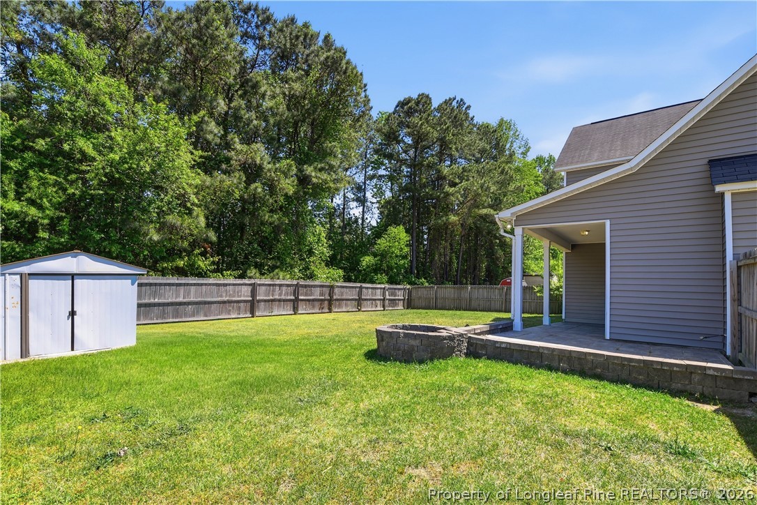140 Birch Avenue Spring Lake, NC 28390 - Photo 9 of 49 a backyard of a house with table and chairs