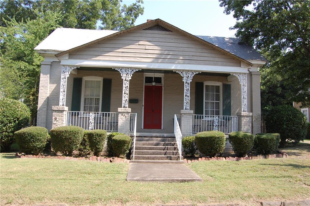 605 West 10th Street Rome, GA 30165 - Photo 1 of 1 a front view of a house with glass windows and yard