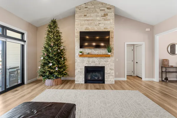 a living room with a fireplace a flat screen tv and a fireplace