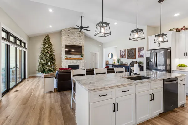 a kitchen with a refrigerator and microwave