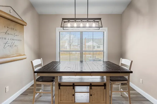 a room with table and chairs