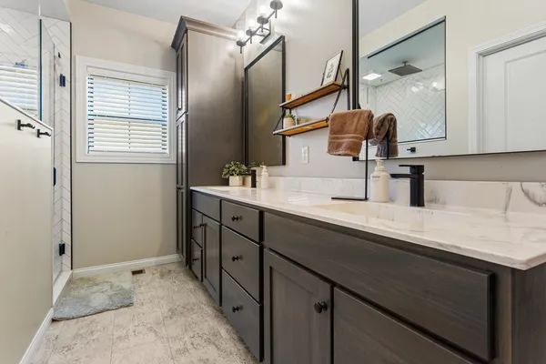 a bathroom with a sink and mirror