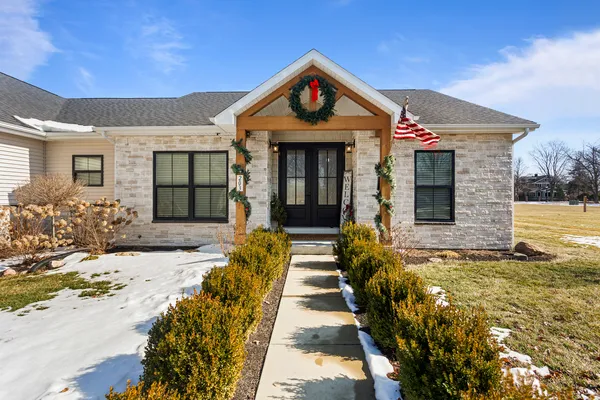 a front view of a house with a small yard