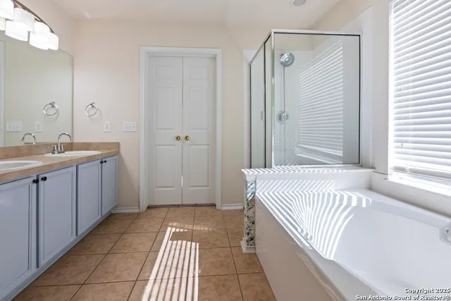 a bathroom with a bathtub and a sink