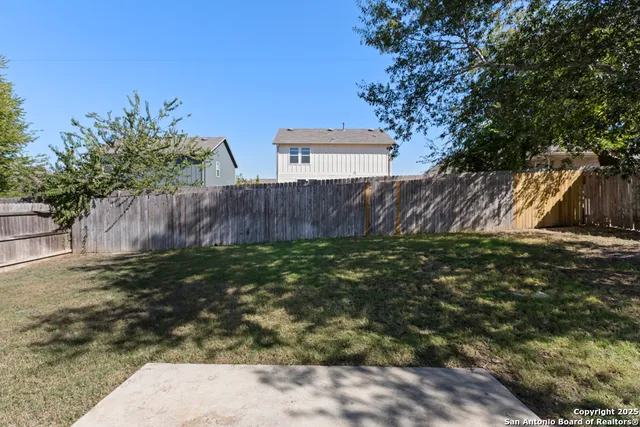 a view of a house with a tree in a yard