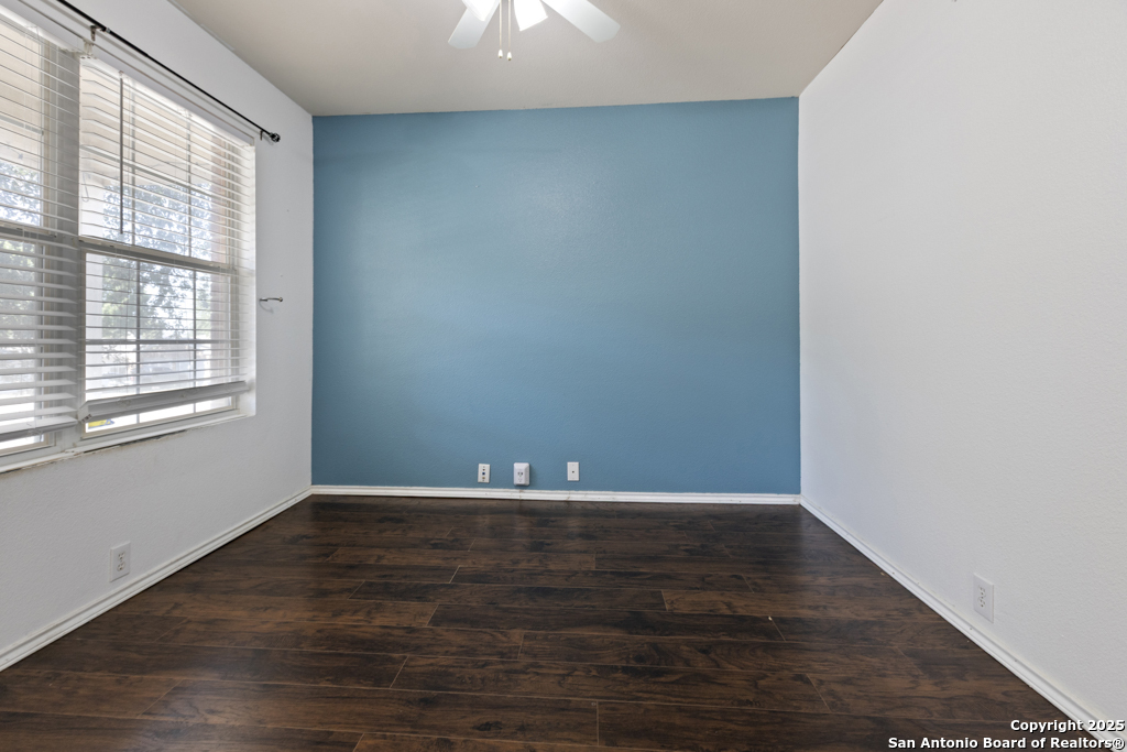 5109 Brookline Schertz, TX 78108 - Photo 4 of 35 a view of an empty room with wooden floor and a window