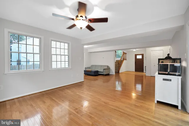 a view of a livingroom with a kitchen and a stove top oven