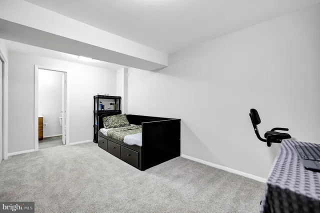 a bedroom with bed and window