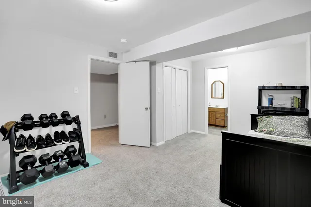 a bedroom with a bed and a couch