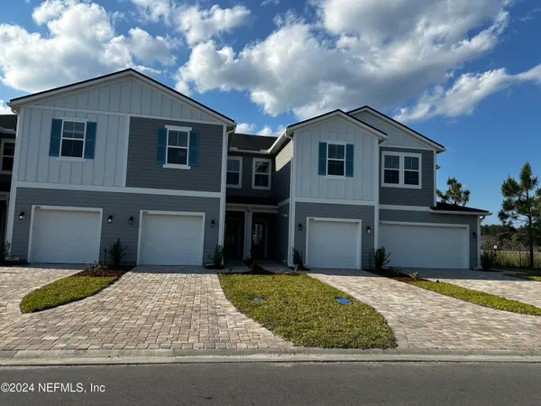 a front view of a house with garage