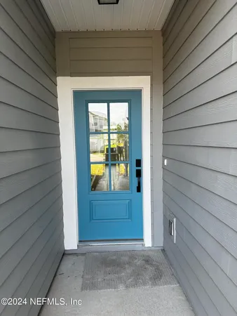 a large kitchen with stainless steel appliances a sink stove and refrigerator
