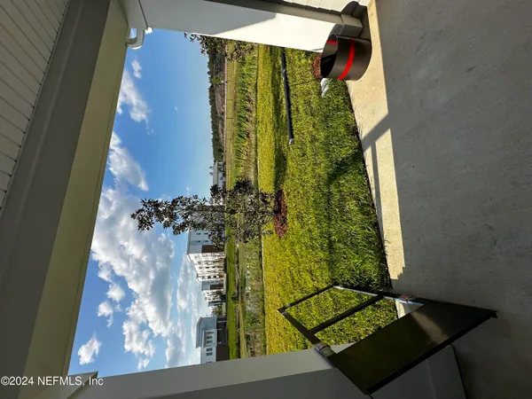 a view of a house with pool and a view of a lake