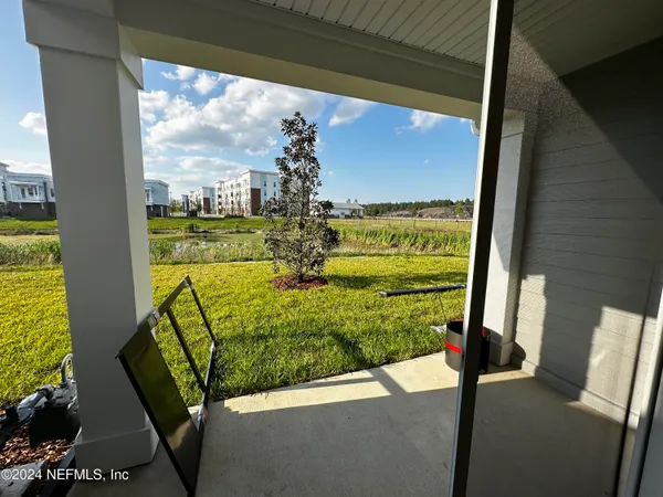 a front view of a house with outdoor space and seating area