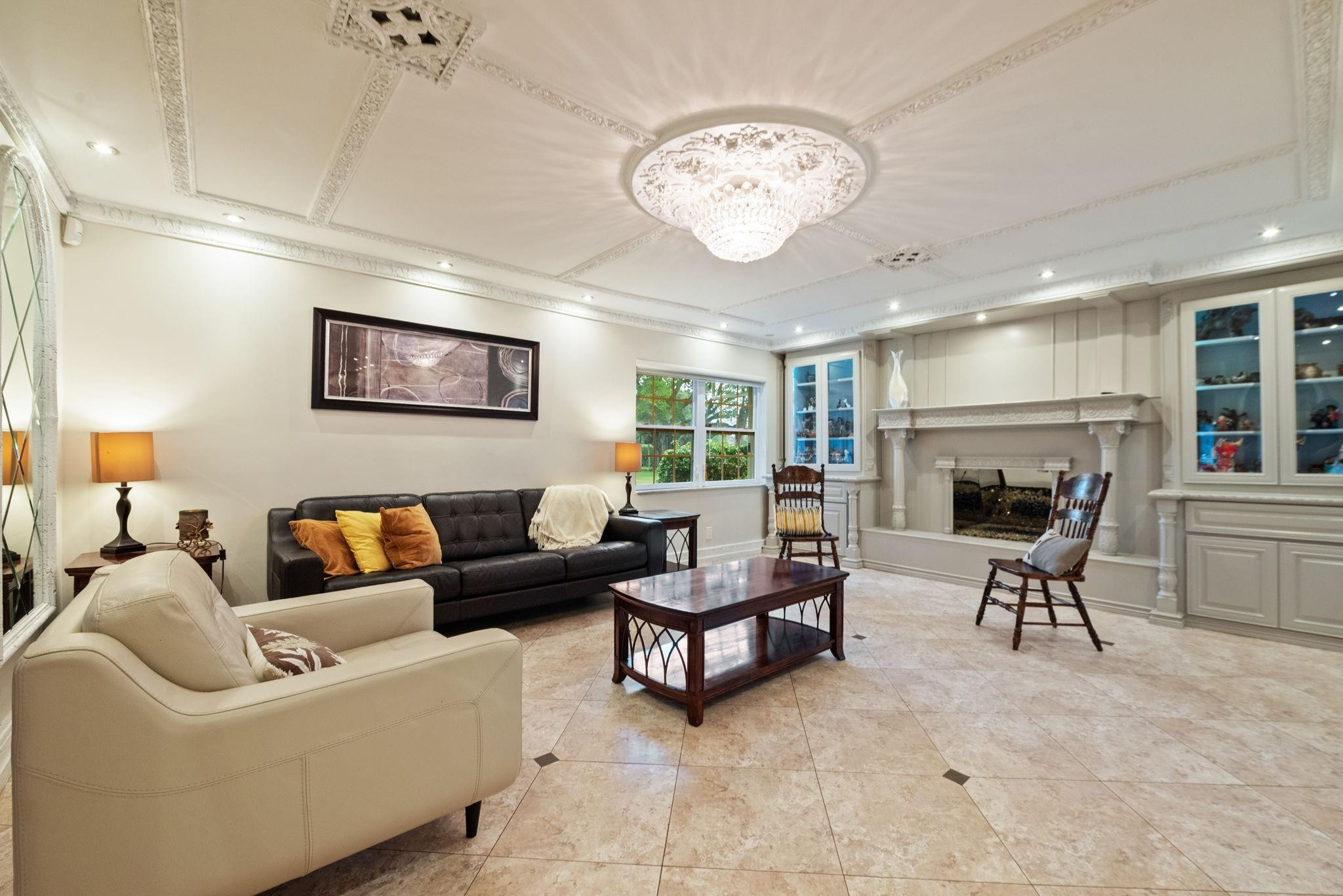 17501 Southwest 54th Street Southwest Ranches, FL 33331 - Photo 14 of 39 a living room with furniture a fireplace and a table