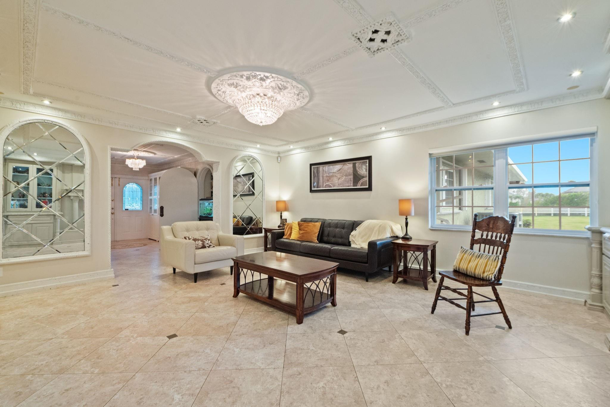 17501 Southwest 54th Street Southwest Ranches, FL 33331 - Photo 15 of 39 a living room with furniture and a large window