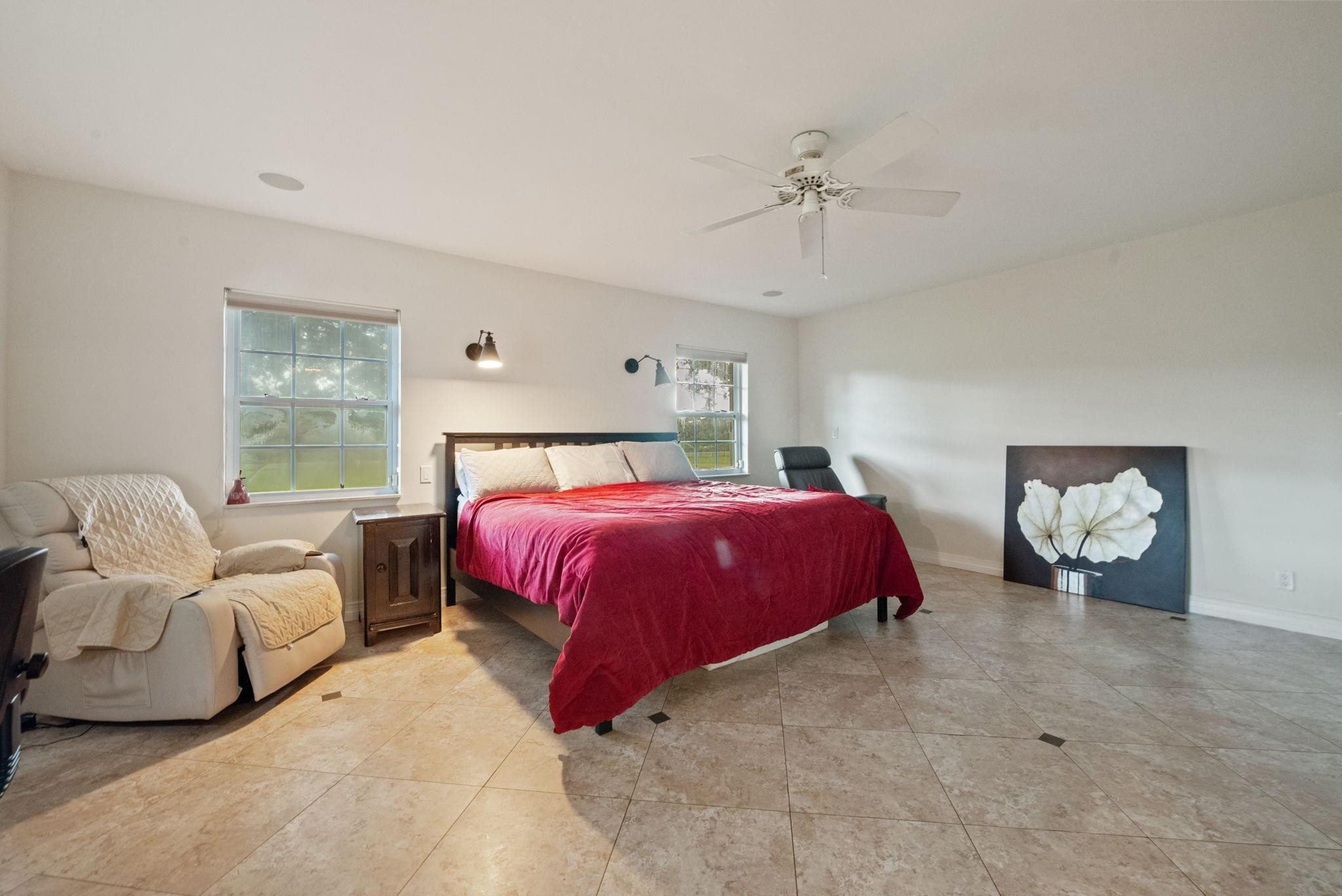17501 Southwest 54th Street Southwest Ranches, FL 33331 - Photo 21 of 39 a spacious bedroom with a bed and window