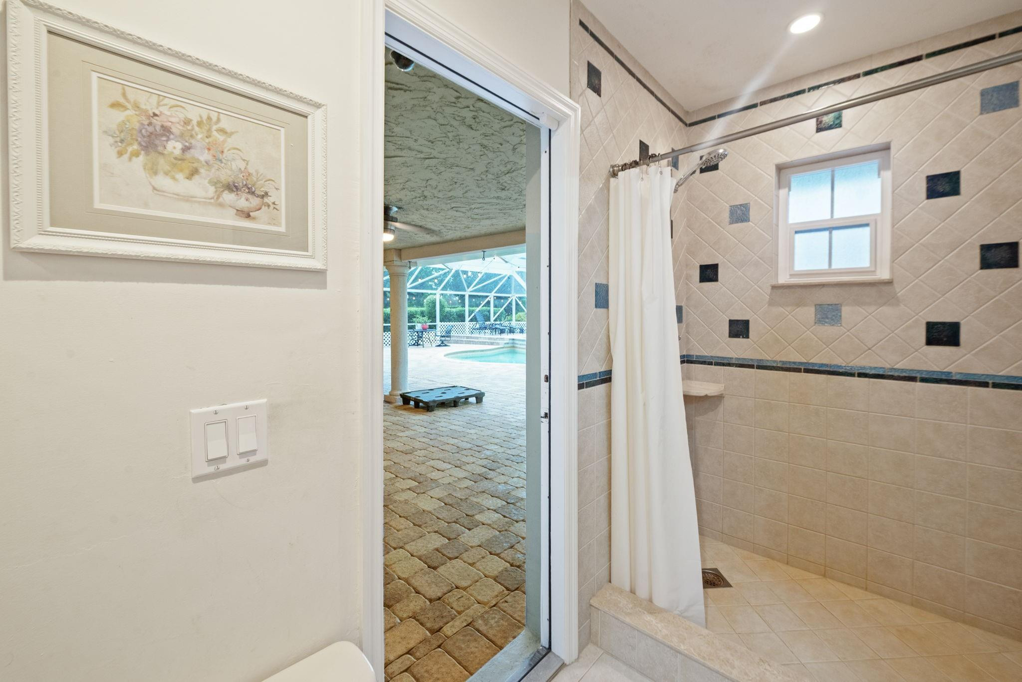 17501 Southwest 54th Street Southwest Ranches, FL 33331 - Photo 28 of 39 a bathroom with a shower and a bath tub