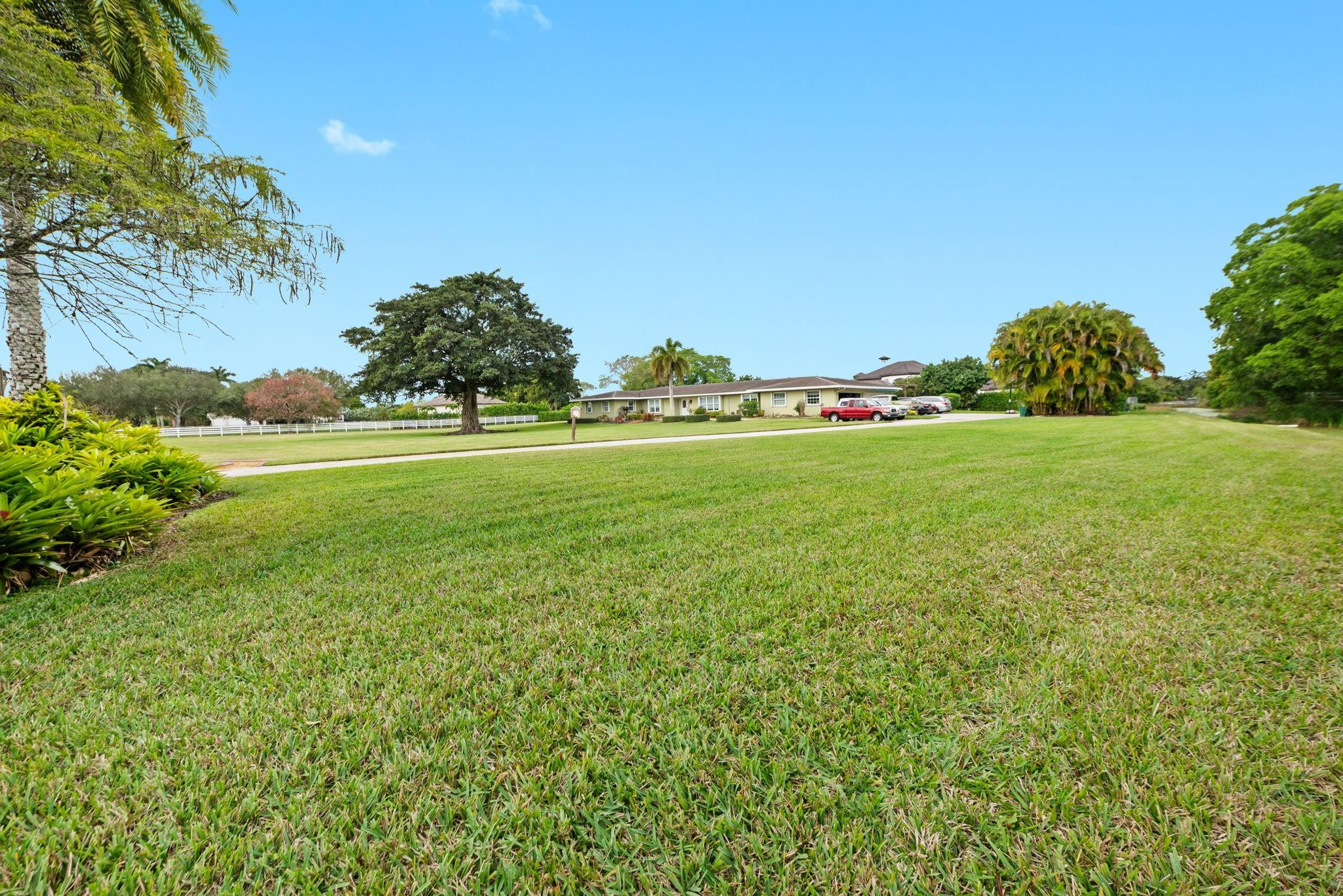 17501 Southwest 54th Street Southwest Ranches, FL 33331 - Photo 6 of 39 a view of a grassy field with an trees