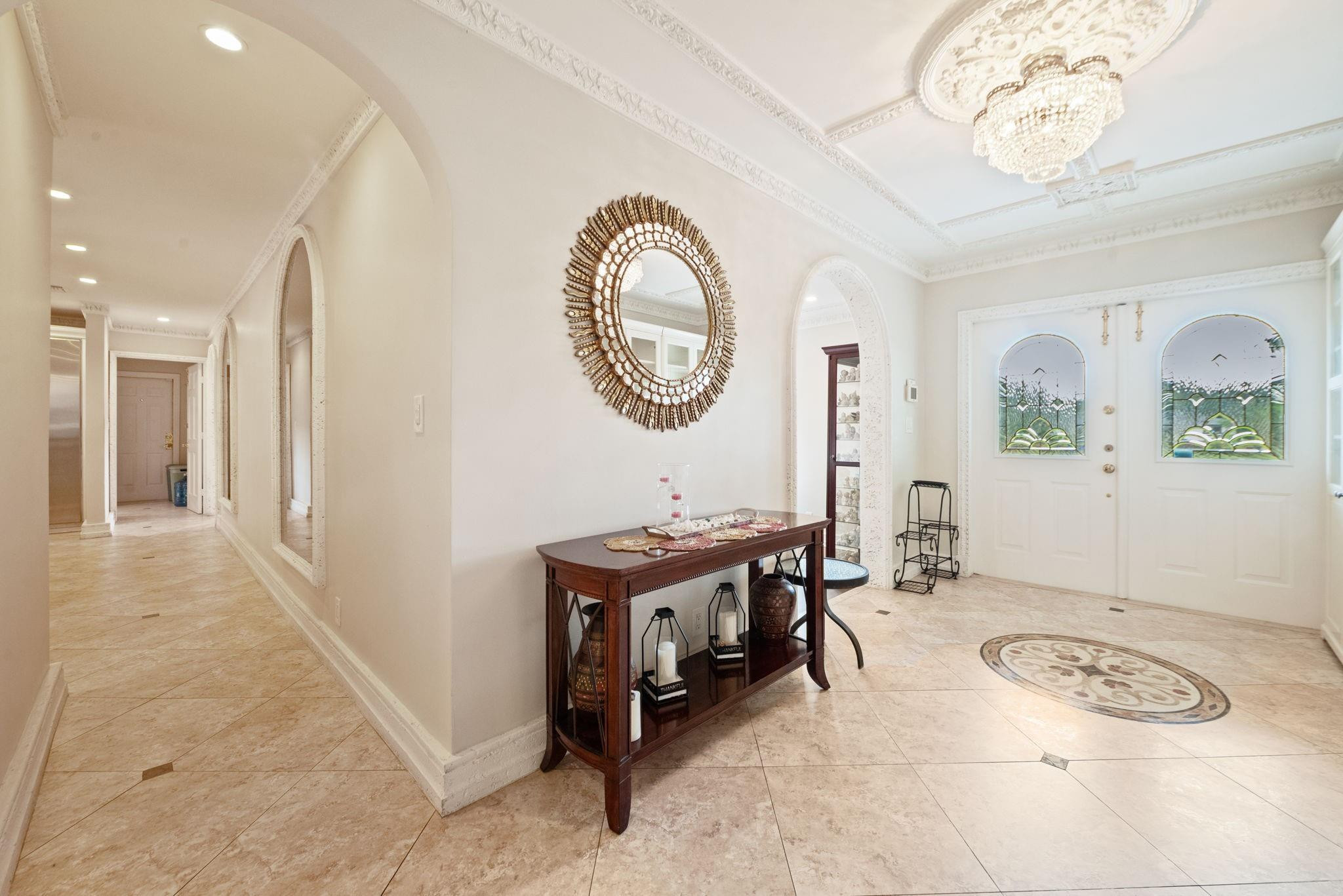 17501 Southwest 54th Street Southwest Ranches, FL 33331 - Photo 9 of 39 a hall way with furniture a mirror and a window