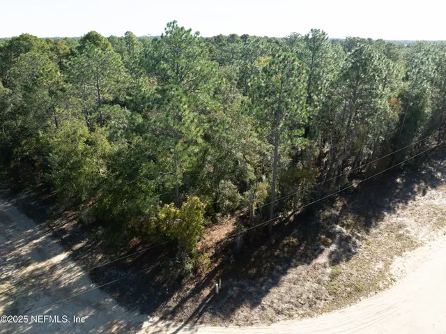a view of a yard covered with snow in the yard