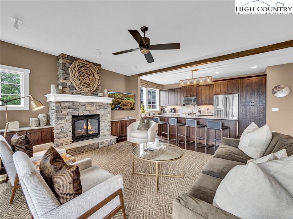 198 Ramblestone Terrace, Unit 203 Boone, NC 28607 - Photo 14 of 39 a living room with furniture and a fireplace