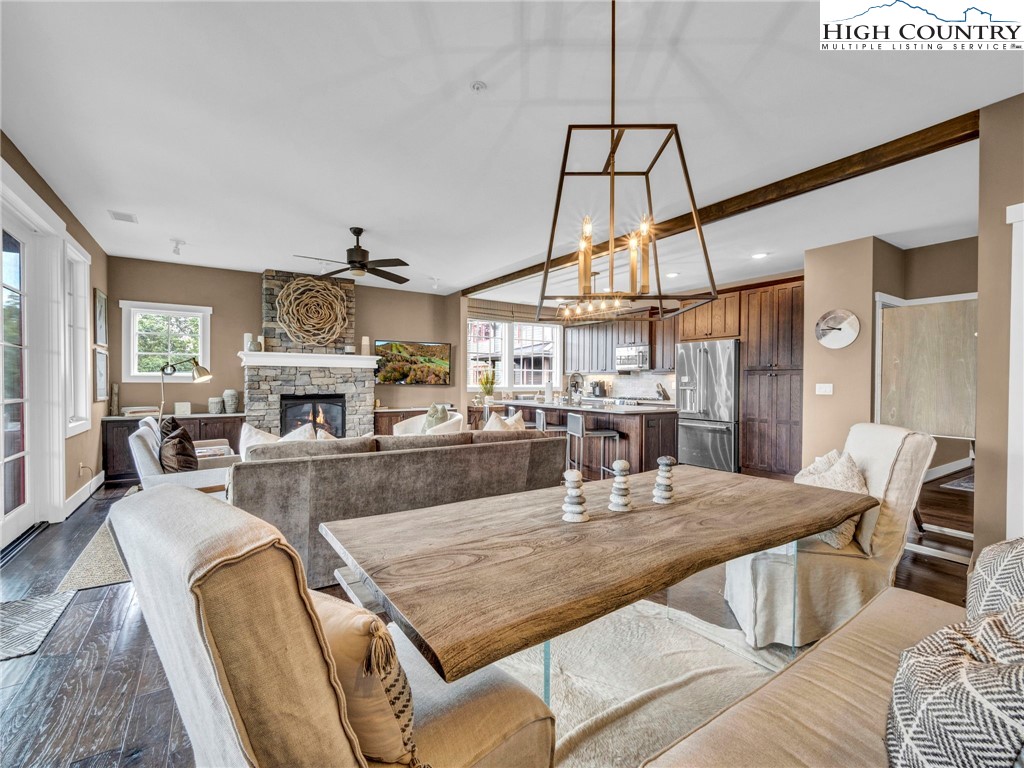 198 Ramblestone Terrace, Unit 203 Boone, NC 28607 - Photo 15 of 39 a dining room with furniture a rug and wooden floor
