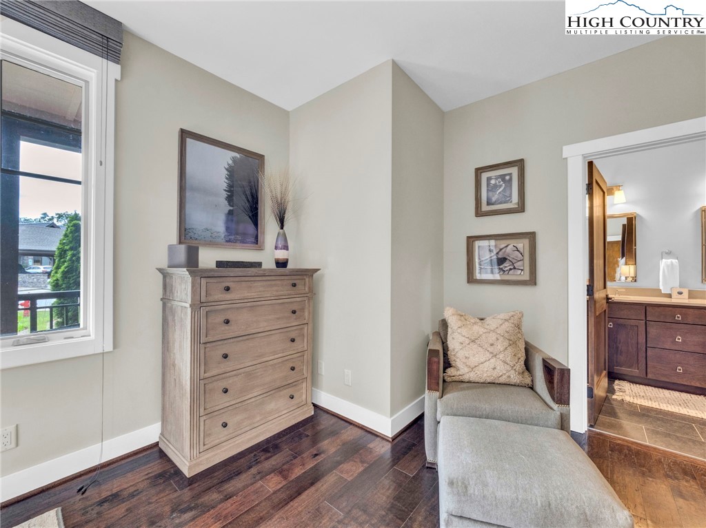 198 Ramblestone Terrace, Unit 203 Boone, NC 28607 - Photo 21 of 39 a bed room with a bed and a mirror