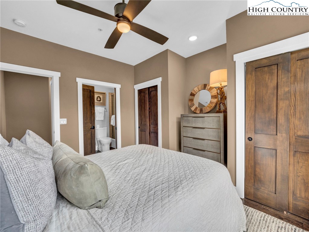 198 Ramblestone Terrace, Unit 203 Boone, NC 28607 - Photo 26 of 39 a bedroom with a bed and a cabinets