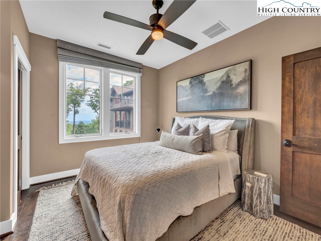 198 Ramblestone Terrace, Unit 203 Boone, NC 28607 - Photo 27 of 39 a bedroom with a large bed and a window