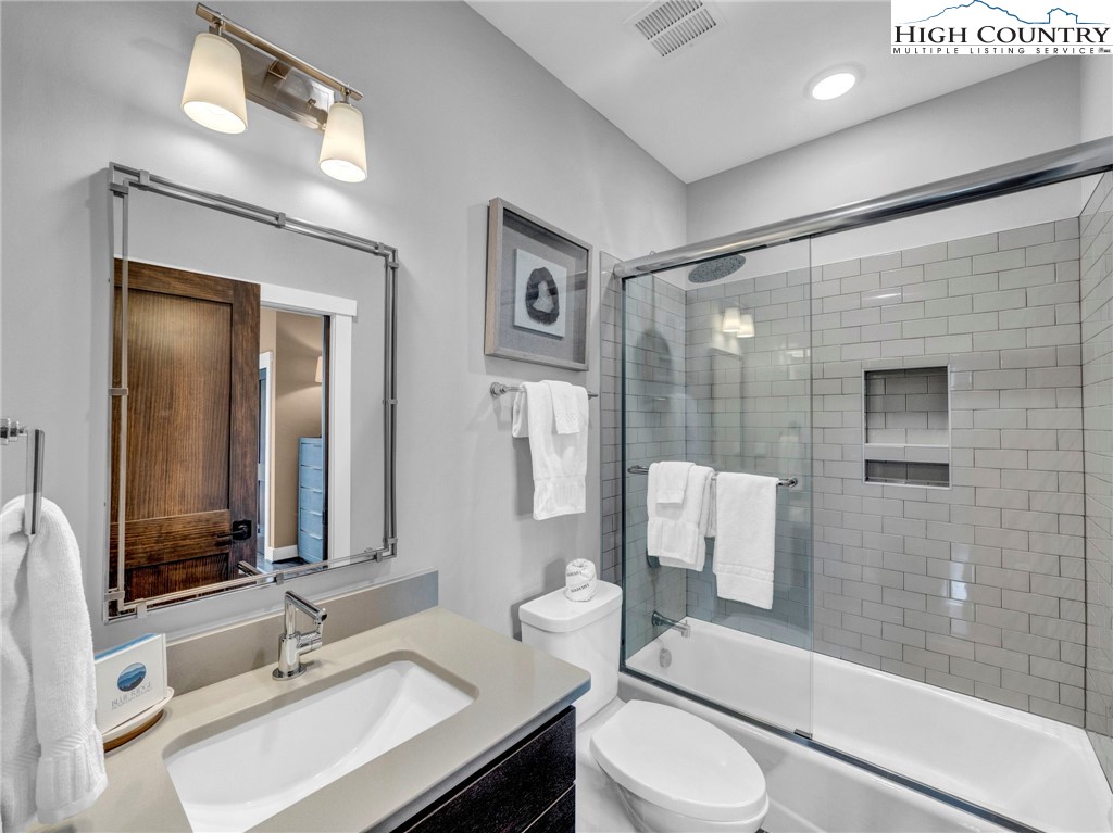 198 Ramblestone Terrace, Unit 203 Boone, NC 28607 - Photo 28 of 39 a bathroom with a sink toilet and shower