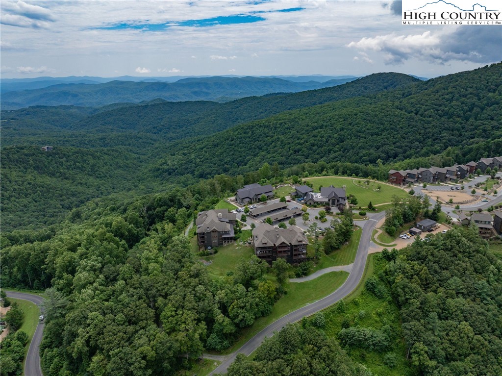 198 Ramblestone Terrace, Unit 203 Boone, NC 28607 - Photo 30 of 39 a view of a city with lush green forest