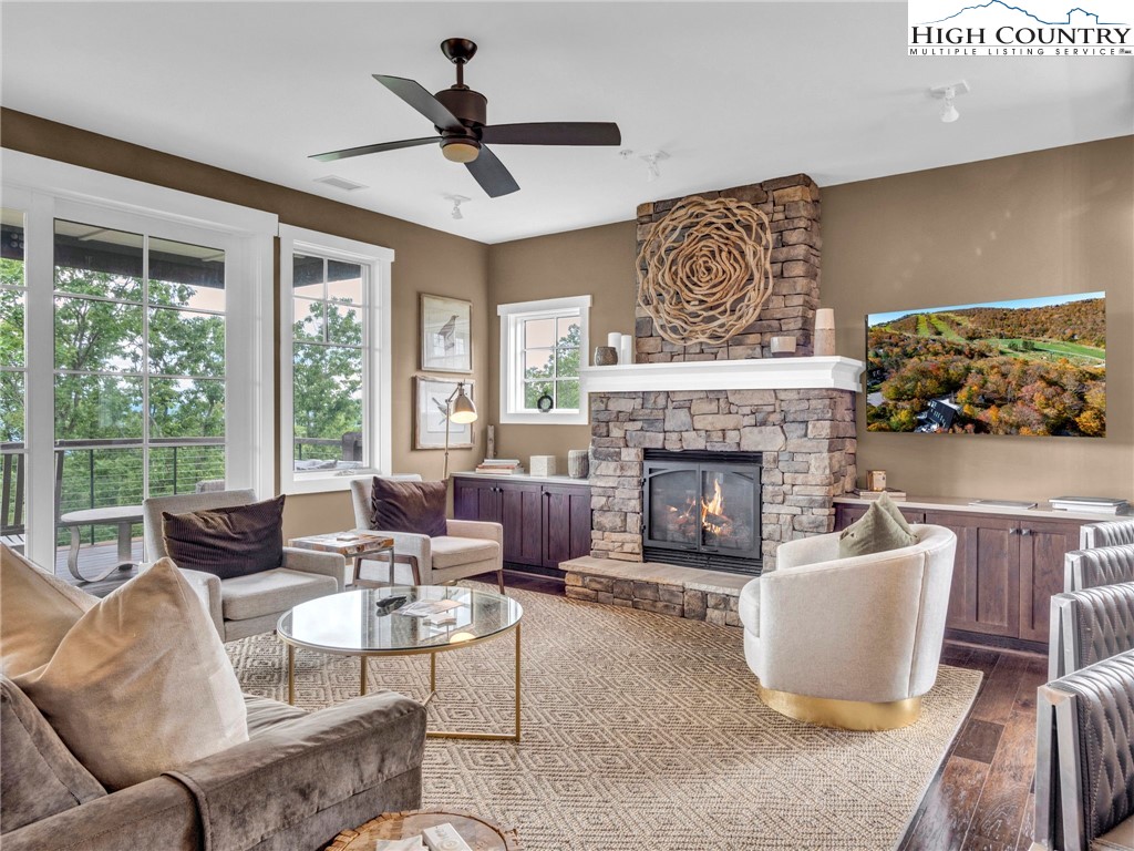 198 Ramblestone Terrace, Unit 203 Boone, NC 28607 - Photo 8 of 39 a living room with furniture and a fireplace