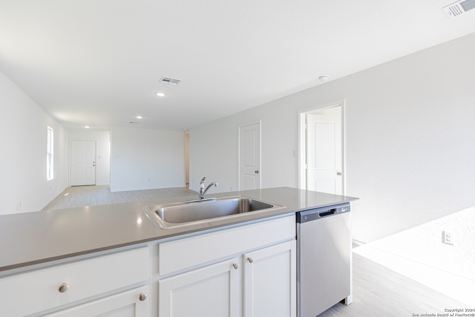 1631 Knoll Ridge New Braunfels, TX 78130 - Photo 12 of 29 a kitchen with a sink and cabinets