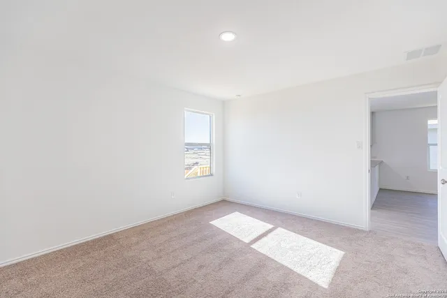 an empty room with windows