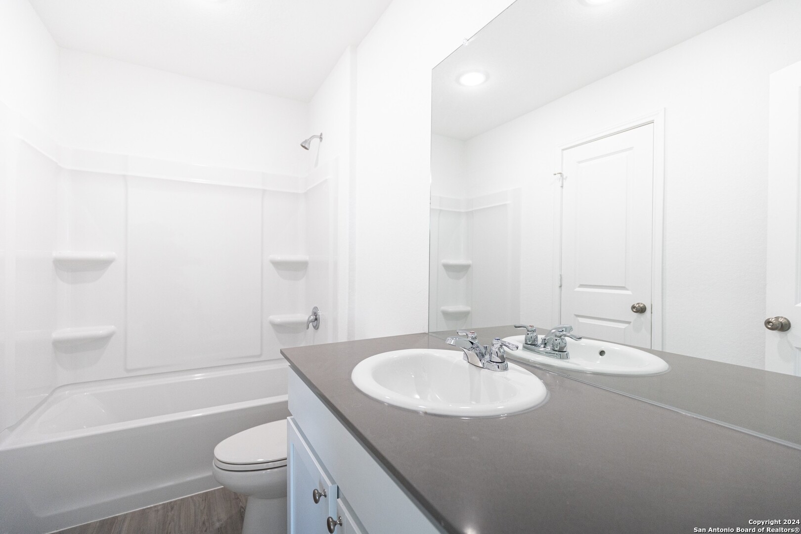 1631 Knoll Ridge New Braunfels, TX 78130 - Photo 16 of 29 a bathroom with a sink and a mirror